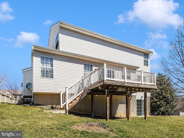 back of house with a lawn, a deck, and stairway