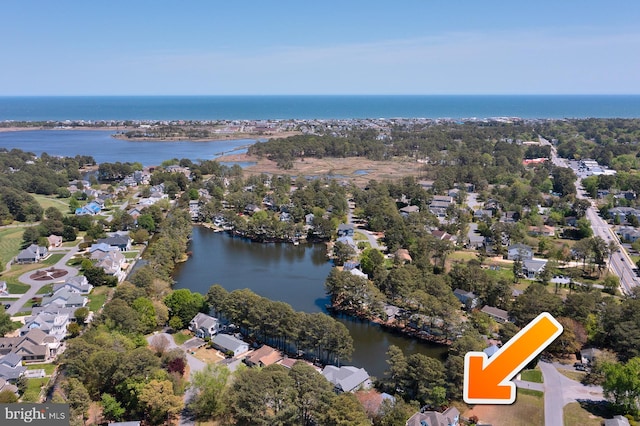 aerial view with a water view and a residential view