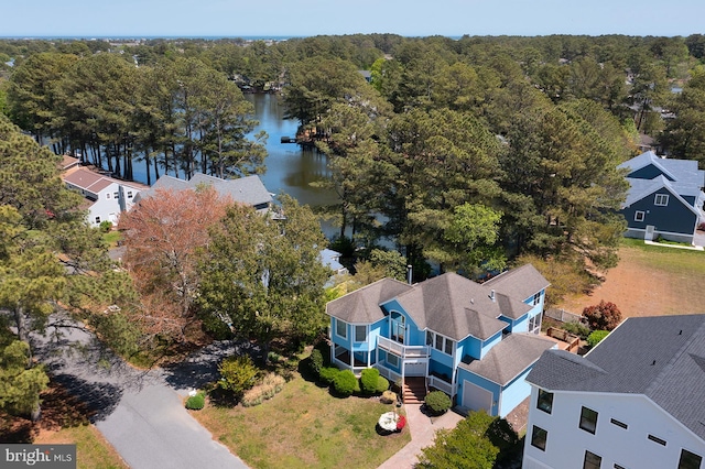 birds eye view of property with a water view and a residential view