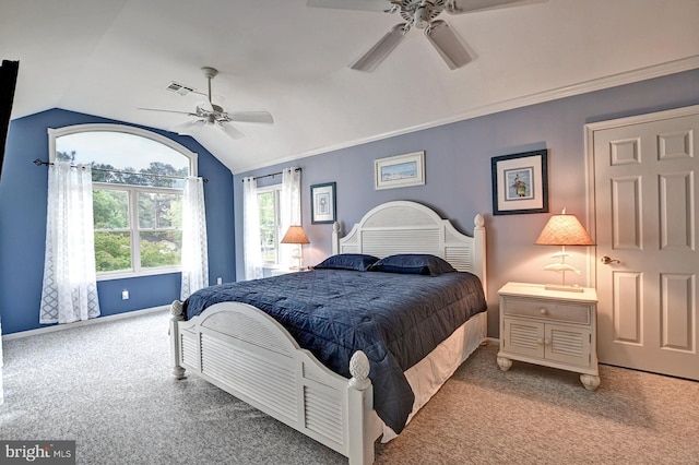 bedroom featuring carpet floors, ceiling fan, vaulted ceiling, and visible vents