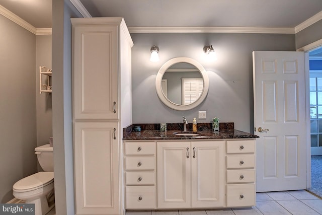 bathroom featuring crown molding, tile patterned floors, toilet, and vanity