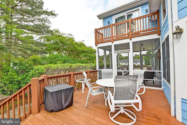 deck with outdoor dining area