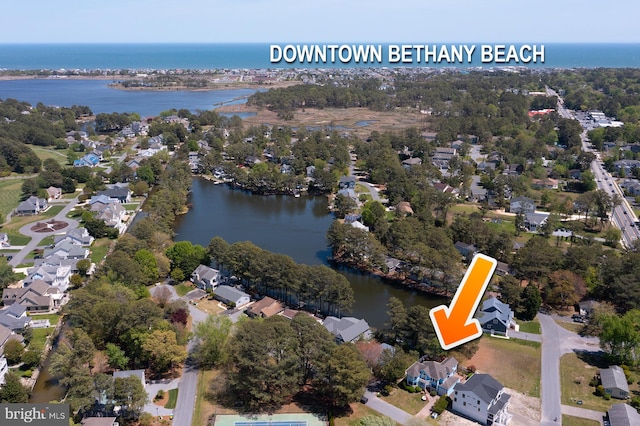 birds eye view of property featuring a water view and a residential view