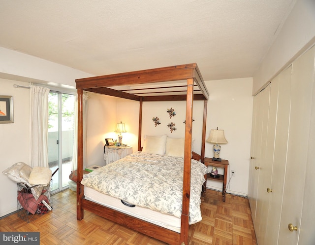 bedroom with access to outside and a closet