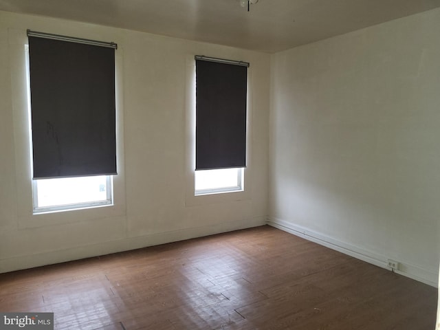 423 Furrow St, Baltimore, MD 21223 - empty room featuring baseboards and wood finished floors