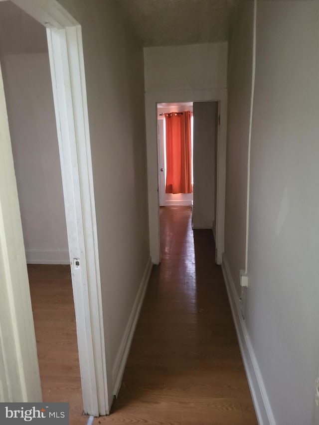 423 Furrow St, Baltimore, MD 21223 - hallway featuring baseboards and wood finished floors