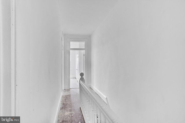 corridor featuring baseboards