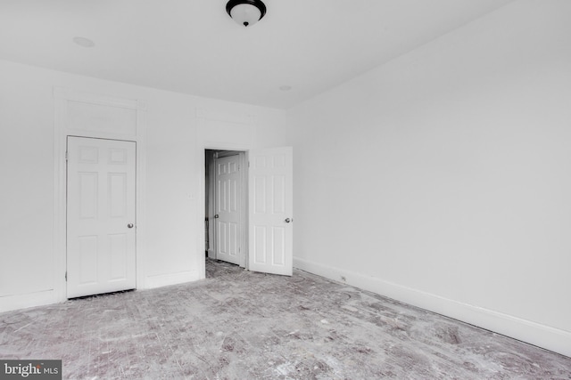 unfurnished bedroom with baseboards