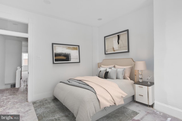 bedroom featuring baseboards
