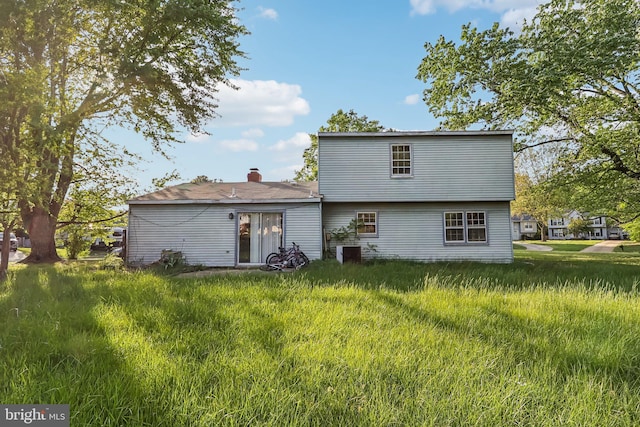 rear view of house featuring cooling unit