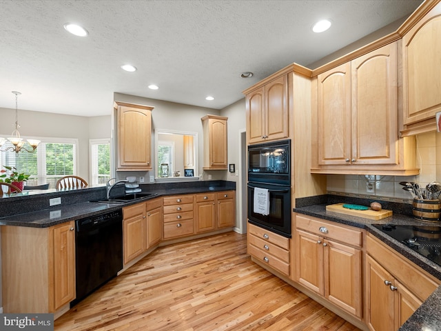 114 New Market Dr, Stephens City, VA 22655 - kitchen featuring black appliances, a sink, light wood-type flooring, light brown cabinets, and recessed lighting