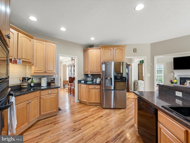 114 New Market Dr, Stephens City, VA 22655 - kitchen with black dishwasher, light wood-style floors, stainless steel refrigerator with ice dispenser, backsplash, and light brown cabinetry