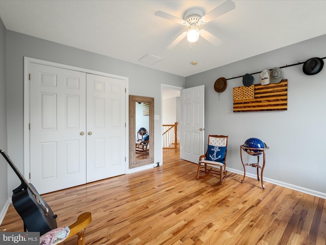 114 New Market Dr, Stephens City, VA 22655 - sitting room with light wood-style flooring, an upstairs landing, baseboards, and a ceiling fan