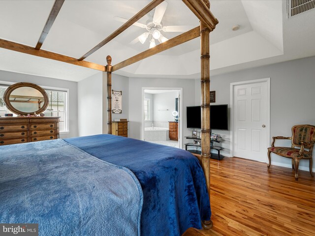 114 New Market Dr, Stephens City, VA 22655 - bedroom with wood finished floors, connected bathroom, baseboards, a raised ceiling, and ceiling fan