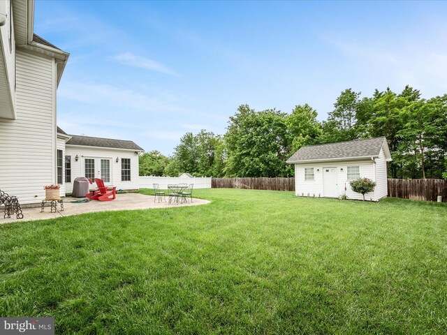 114 New Market Dr, Stephens City, VA 22655 - view of yard with a patio, french doors, and an outbuilding