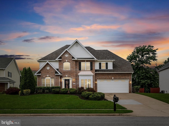 114 New Market Dr, Stephens City, VA 22655 - view of front facade with brick siding, concrete driveway, a yard, and a shingled roof