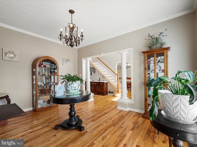 114 New Market Dr, Stephens City, VA 22655 - dining room featuring light wood-style floors, crown molding, baseboards, a chandelier, and stairs