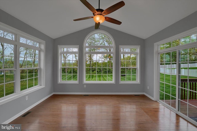 unfurnished sunroom featuring a healthy amount of sunlight and visible vents