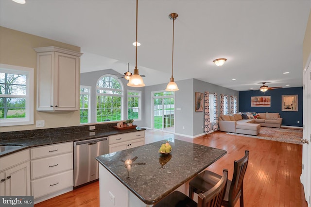 kitchen with white cabinetry, light wood-type flooring, a ceiling fan, and dishwasher