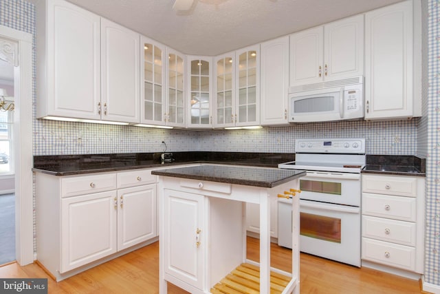 729 Rosecroft Ct, Forest Hill, MD 21050 - kitchen featuring white appliances, light wood finished floors, glass insert cabinets, and white cabinets