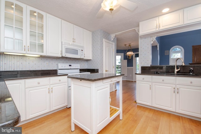 729 Rosecroft Ct, Forest Hill, MD 21050 - kitchen with white appliances, a sink, glass insert cabinets, white cabinets, and a textured ceiling