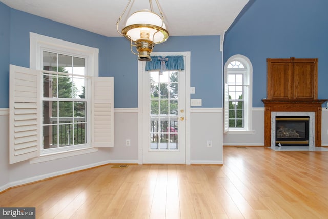 729 Rosecroft Ct, Forest Hill, MD 21050 - unfurnished dining area with a fireplace with flush hearth, wood finished floors, and baseboards