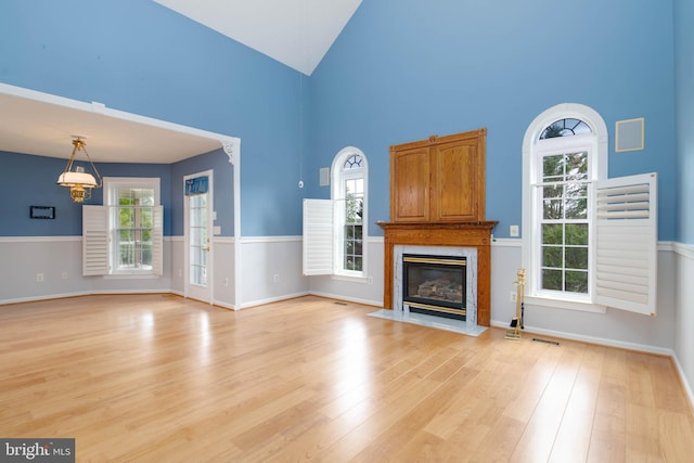 729 Rosecroft Ct, Forest Hill, MD 21050 - unfurnished living room featuring high vaulted ceiling, a fireplace, light wood-style flooring, and baseboards