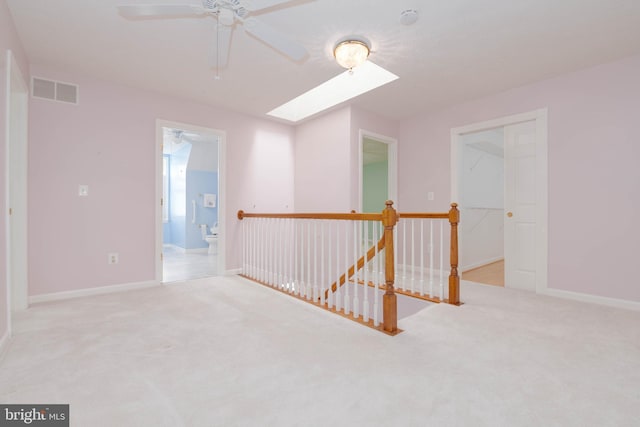 729 Rosecroft Ct, Forest Hill, MD 21050 - spare room with ceiling fan, a skylight, carpet, and baseboards