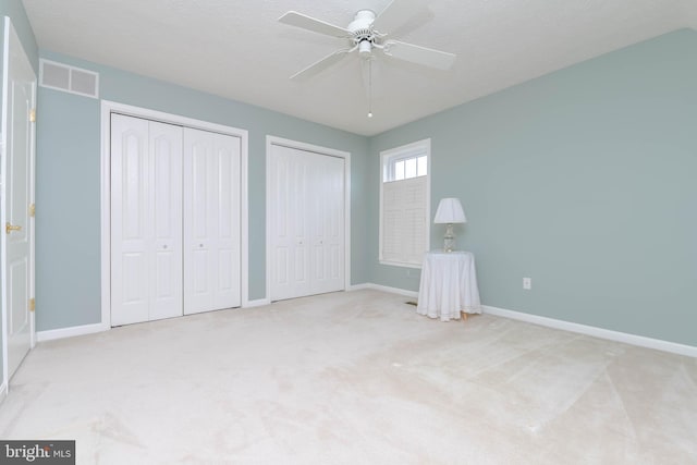 729 Rosecroft Ct, Forest Hill, MD 21050 - unfurnished bedroom with multiple closets, baseboards, carpet floors, and ceiling fan