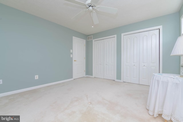 729 Rosecroft Ct, Forest Hill, MD 21050 - unfurnished bedroom with two closets, baseboards, carpet flooring, and ceiling fan