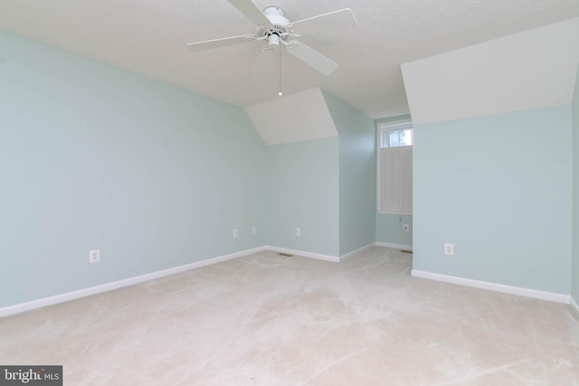 729 Rosecroft Ct, Forest Hill, MD 21050 - bonus room featuring a ceiling fan, light carpet, vaulted ceiling, baseboards, and a textured ceiling
