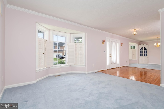 729 Rosecroft Ct, Forest Hill, MD 21050 - unfurnished living room with carpet, crown molding, baseboards, a chandelier, and plenty of natural light