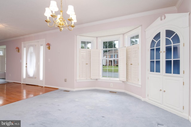 729 Rosecroft Ct, Forest Hill, MD 21050 - unfurnished dining area with crown molding, carpet floors, a chandelier, and baseboards