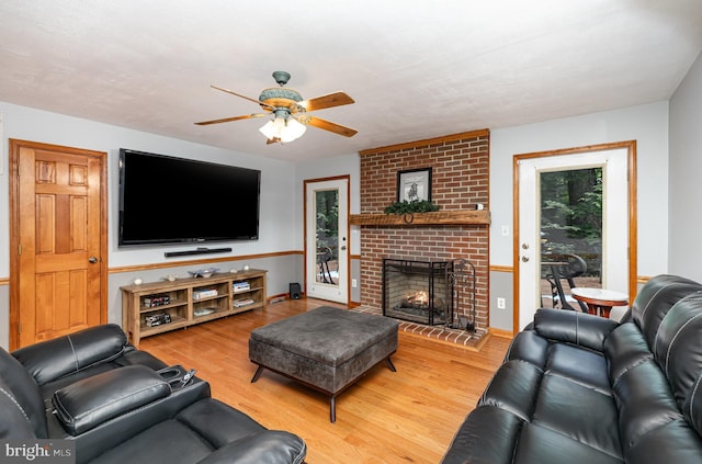 120 Hartwood Meadows Dr, Fredericksburg, VA 22406 - living area featuring a ceiling fan, wood finished floors, and a brick fireplace