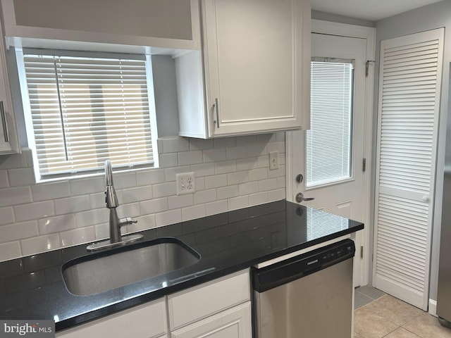 371 Chaplin St SE, Washington, DC 20019 - kitchen featuring stainless steel dishwasher, a sink, dark countertops, and tasteful backsplash