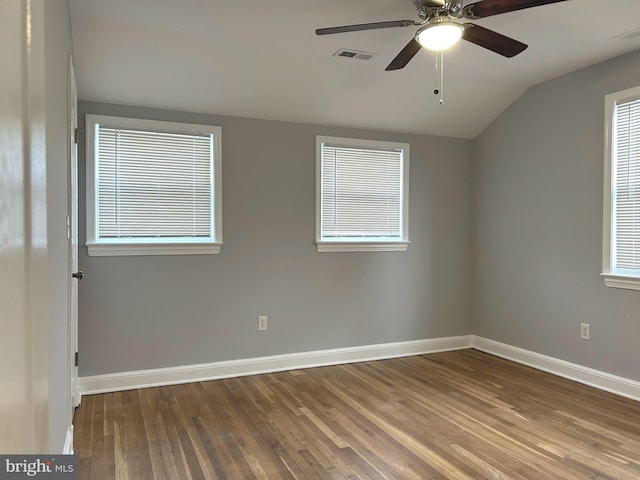 371 Chaplin St SE, Washington, DC 20019 - empty room featuring lofted ceiling, hardwood / wood-style flooring, a ceiling fan, baseboards, and plenty of natural light