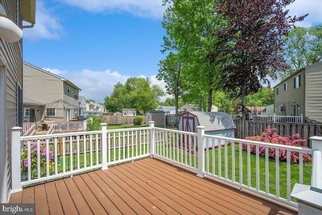 9402 Glen Ridge Dr, Laurel, MD 20723 - deck featuring a storage unit, a residential view, and an outbuilding