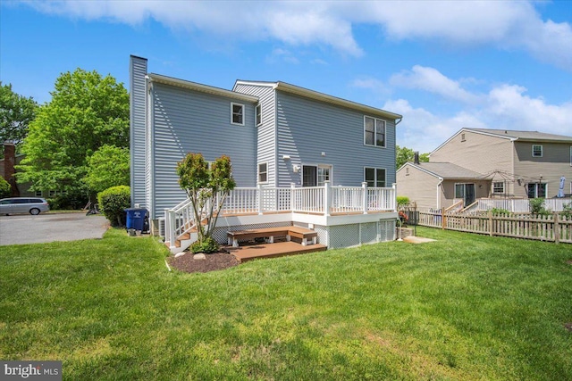 9402 Glen Ridge Dr, Laurel, MD 20723 - rear view of property featuring a wooden deck and a chimney