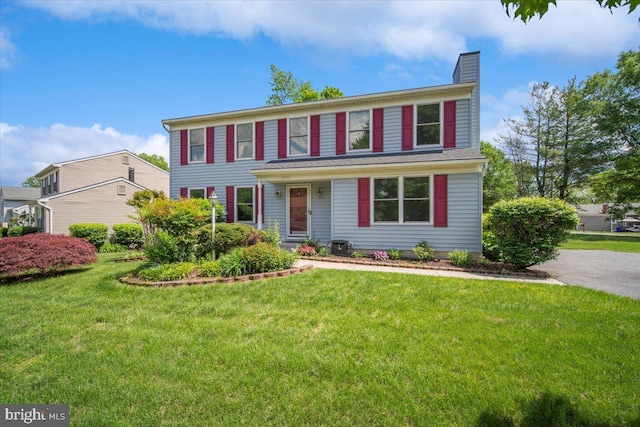 9402 Glen Ridge Dr, Laurel, MD 20723 - colonial home featuring a chimney and a front yard