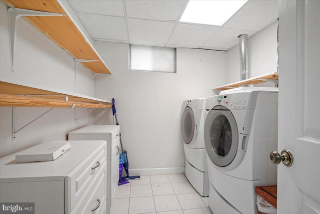 9402 Glen Ridge Dr, Laurel, MD 20723 - laundry area featuring washer and dryer, baseboards, and light tile patterned floors