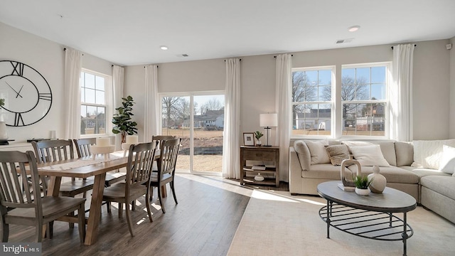 dining area with recessed lighting, visible vents, and wood finished floors