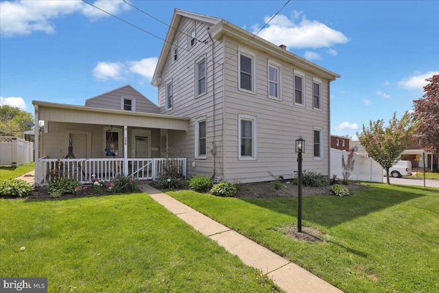 304 Charles Rd, Lancaster, PA 17603 - view of front of house with fence, a porch, and a front yard