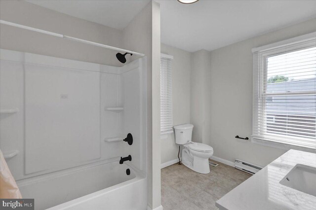 304 Charles Rd, Lancaster, PA 17603 - full bathroom featuring baseboard heating, shower / tub combination, baseboards, tile patterned floors, and toilet