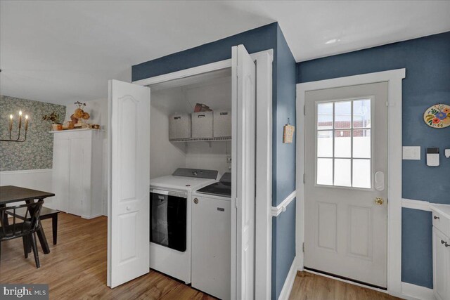 304 Charles Rd, Lancaster, PA 17603 - clothes washing area featuring laundry area, washing machine and dryer, light wood-type flooring, and a chandelier