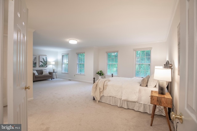 bedroom featuring ornamental molding, carpet floors, multiple windows, and baseboards