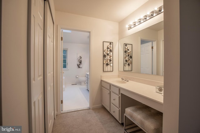full bath featuring vanity and toilet