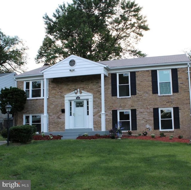 1305 Wendover Ct, District Heights, MD 20747 - split foyer home with a front lawn and brick siding