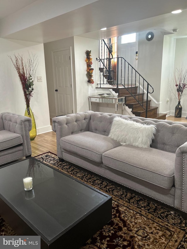 1305 Wendover Ct, District Heights, MD 20747 - living area with stairs, baseboards, and light wood finished floors