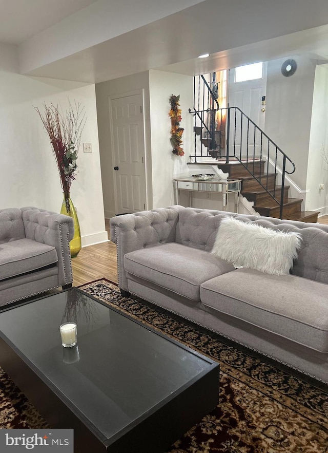 1305 Wendover Ct, District Heights, MD 20747 - living room featuring stairs, baseboards, and light wood-style flooring