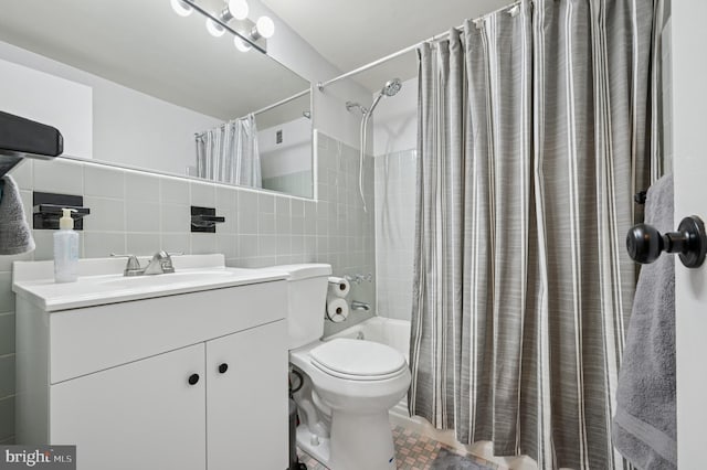 full bath featuring vanity, shower / tub combo with curtain, decorative backsplash, toilet, and tile walls